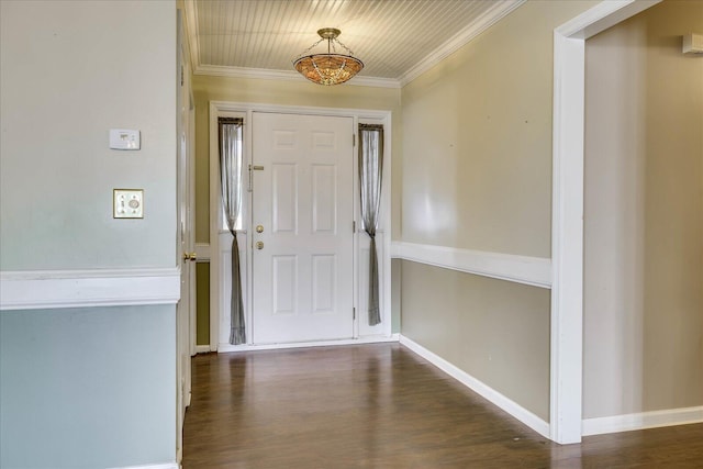 entrance foyer with dark wood-type flooring and ornamental molding