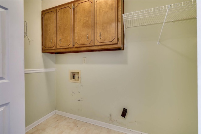 laundry room with cabinets and washer hookup