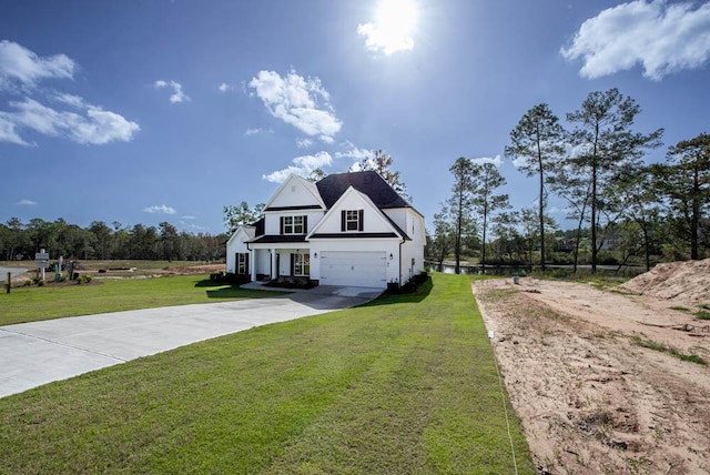 view of front of house featuring a front lawn and a garage