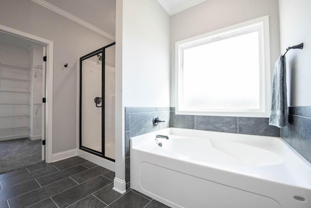 bathroom with ornamental molding, tile patterned floors, and independent shower and bath