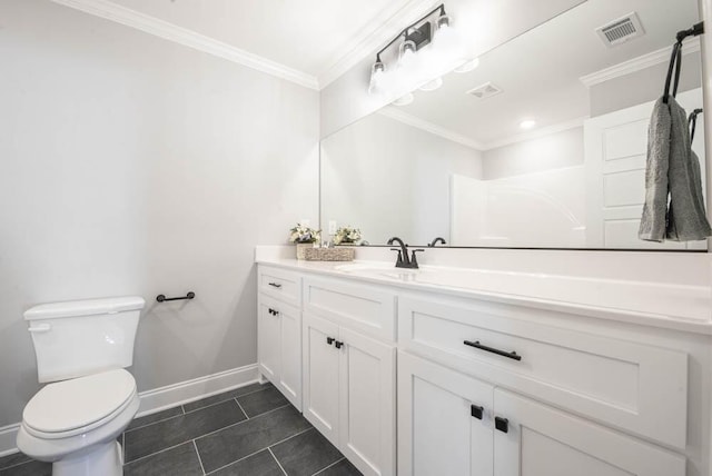 bathroom with ornamental molding, vanity, tile patterned floors, and toilet