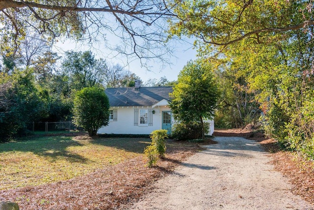 view of side of property with a yard