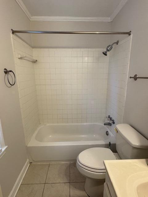 bathroom with tile patterned flooring, vanity, ornamental molding, and shower / bathtub combination