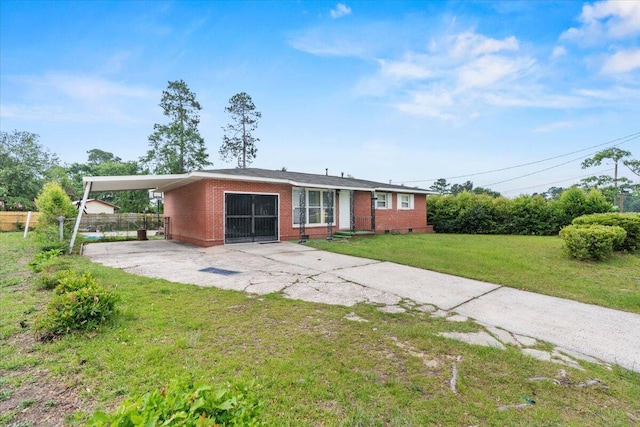 3318 Forest Estates Dr, Augusta, GA 30909 - ranch-style home with a carport, driveway, and brick siding