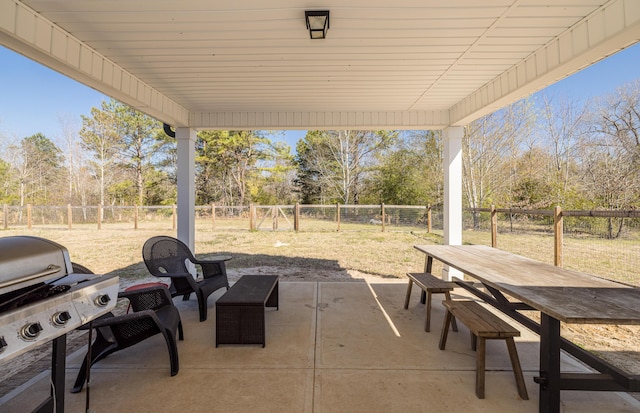 view of patio / terrace featuring outdoor dining space, a fenced backyard, and a grill