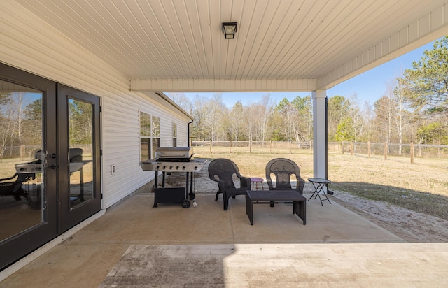 view of patio / terrace featuring french doors, area for grilling, and a fenced backyard