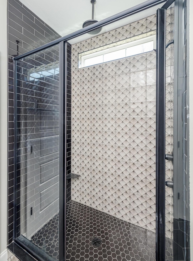 bathroom featuring a shower stall