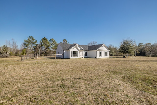 exterior space featuring a yard and fence