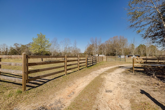 view of road featuring a rural view and driveway