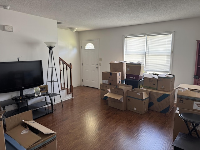 3909 Roberts Rd, Augusta, GA 30907 - living area featuring wood finished floors, stairway, and a textured ceiling