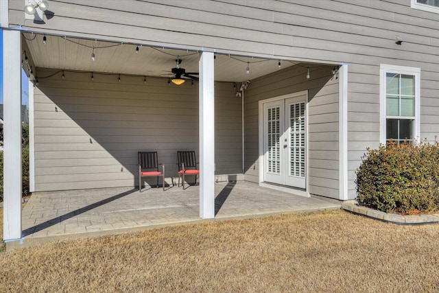 entrance to property featuring a patio and ceiling fan