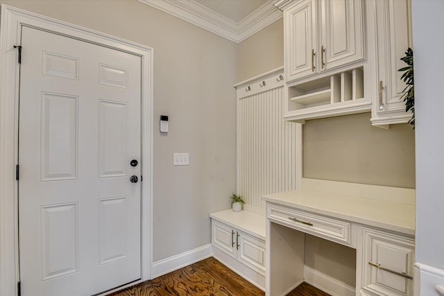 mudroom featuring dark wood-type flooring and ornamental molding