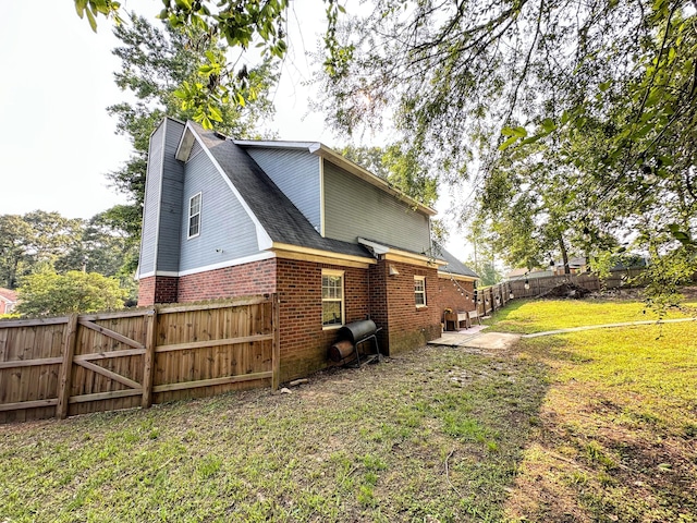 4917 Cavan Pl, Grovetown, GA 30813 - view of home's exterior featuring brick siding, a patio area, and a shingled roof