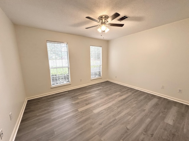 4917 Cavan Pl, Grovetown, GA 30813 - unfurnished room featuring a textured ceiling, dark wood finished floors, a ceiling fan, and baseboards