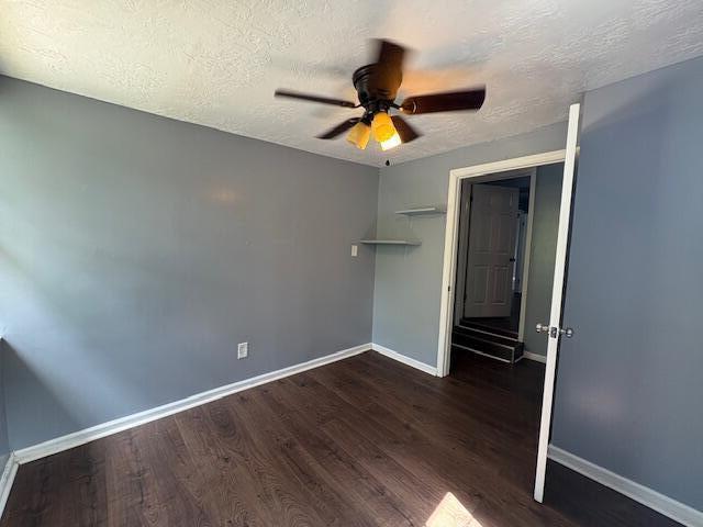 2009 Ryan Rd, Augusta, GA 30904 - unfurnished bedroom featuring dark wood-type flooring, a textured ceiling, and ceiling fan