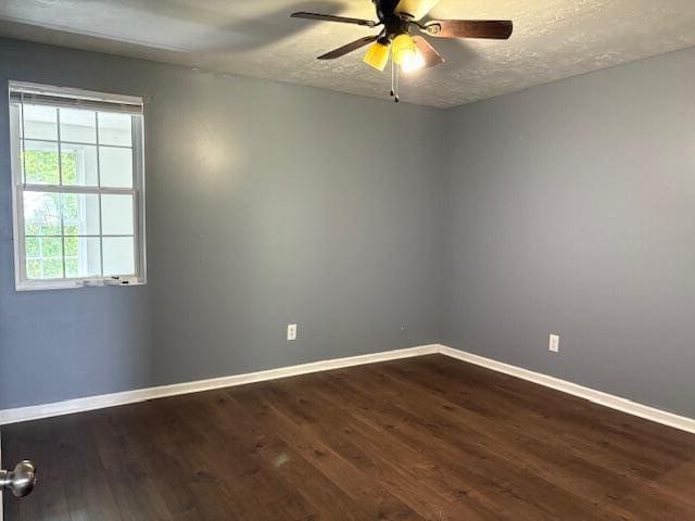 2009 Ryan Rd, Augusta, GA 30904 - unfurnished room with dark wood-type flooring, a ceiling fan, and a textured ceiling