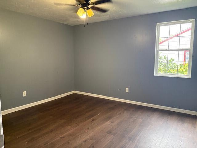 2009 Ryan Rd, Augusta, GA 30904 - empty room with dark wood-style floors, a ceiling fan, and a textured ceiling