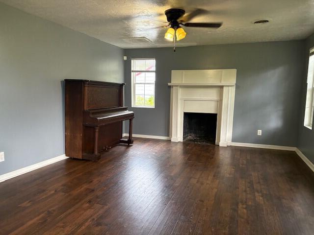 2009 Ryan Rd, Augusta, GA 30904 - unfurnished living room featuring a ceiling fan, wood finished floors, and a fireplace