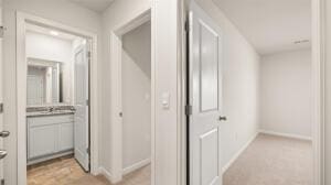 corridor featuring baseboards