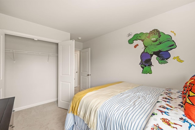bedroom with carpet floors, a closet, and baseboards