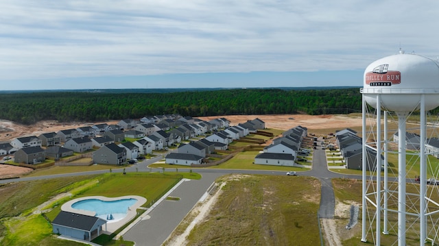 bird's eye view featuring a residential view and a forest view