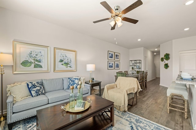 living room with wood finished floors, baseboards, recessed lighting, and ceiling fan