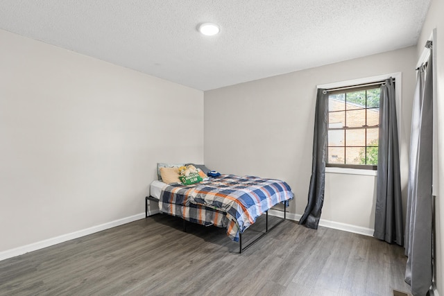 2144 Reedale Ave, Augusta, GA 30906 - bedroom with wood finished floors, a textured ceiling, and baseboards