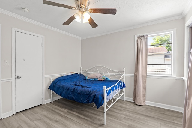 2144 Reedale Ave, Augusta, GA 30906 - bedroom with wood finished floors, ornamental molding, a ceiling fan, and baseboards