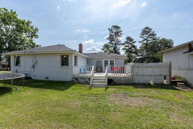 2144 Reedale Ave, Augusta, GA 30906 - back of house with a trampoline, a wooden deck, crawl space, a chimney, and brick siding