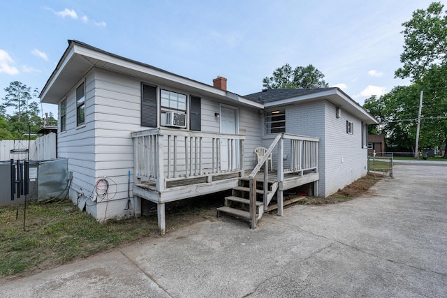 2144 Reedale Ave, Augusta, GA 30906 - back of property with a chimney, asphalt driveway, brick siding, and cooling unit
