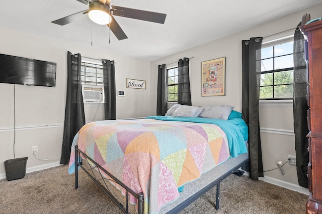 2144 Reedale Ave, Augusta, GA 30906 - carpeted bedroom featuring multiple windows, baseboards, and ceiling fan