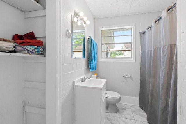 2144 Reedale Ave, Augusta, GA 30906 - full bath featuring marble finish flooring, vanity, toilet, and a shower with shower curtain