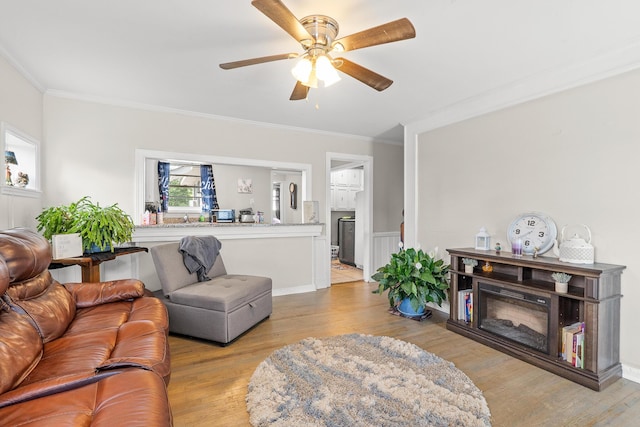 2144 Reedale Ave, Augusta, GA 30906 - living area with crown molding, light wood-type flooring, a ceiling fan, and wainscoting