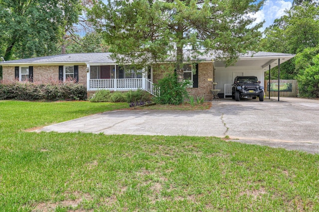 3840 Belair Rd, Augusta, GA 30909 - single story home featuring brick siding, asphalt driveway, covered porch, and a carport