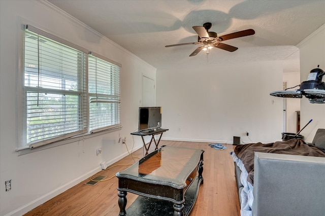 3840 Belair Rd, Augusta, GA 30909 - living room featuring a ceiling fan, light wood-style flooring, and crown molding