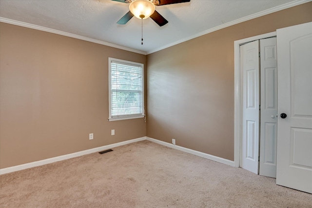 3840 Belair Rd, Augusta, GA 30909 - unfurnished bedroom with carpet floors, ornamental molding, a ceiling fan, and a closet