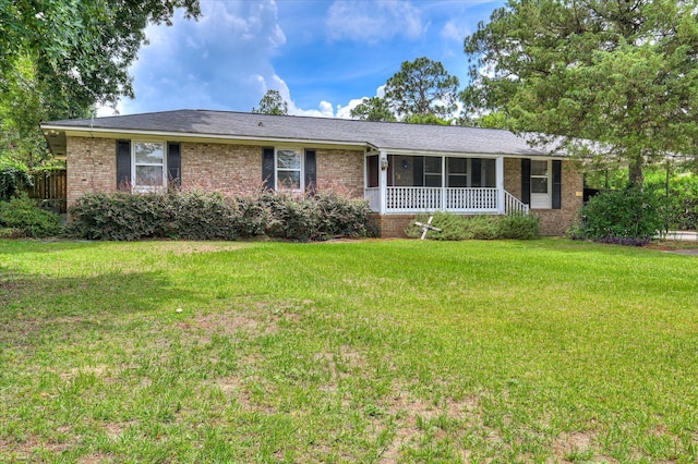 3840 Belair Rd, Augusta, GA 30909 - ranch-style house featuring brick siding, a sunroom, and a front lawn