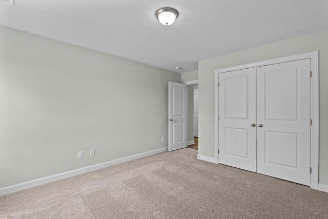1355 Bellingham Dr, Beech Island, SC 29842 - unfurnished bedroom with baseboards, a closet, and carpet