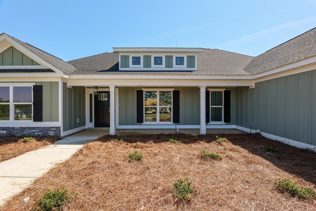 1355 Bellingham Dr, Beech Island, SC 29842 - doorway to property with a porch, board and batten siding, and a shingled roof