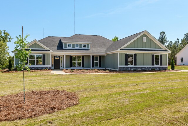 1355 Bellingham Dr, Beech Island, SC 29842 - view of front of house with board and batten siding, a shingled roof, and a front yard