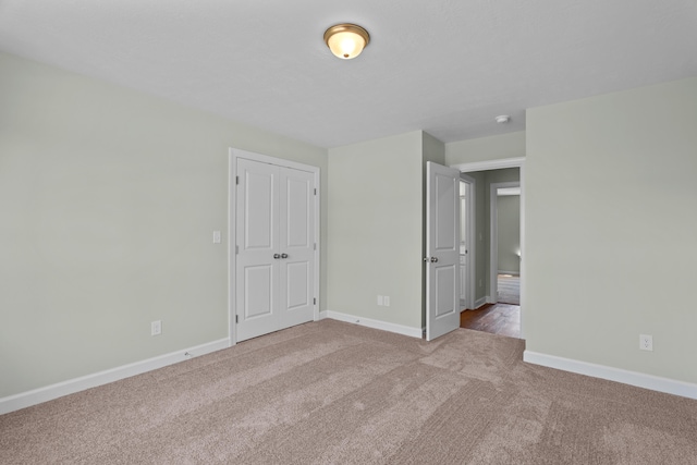 1355 Bellingham Dr, Beech Island, SC 29842 - unfurnished bedroom featuring carpet, a closet, and baseboards
