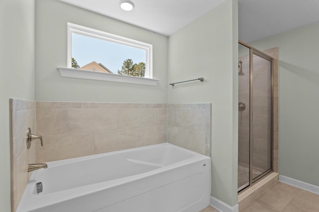 1355 Bellingham Dr, Beech Island, SC 29842 - bathroom featuring a garden tub, baseboards, tile patterned flooring, and a stall shower