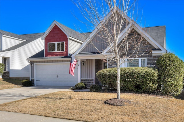 view of front of property with board and batten siding, concrete driveway, and a front lawn