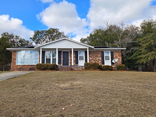 ranch-style house with a porch and a front lawn