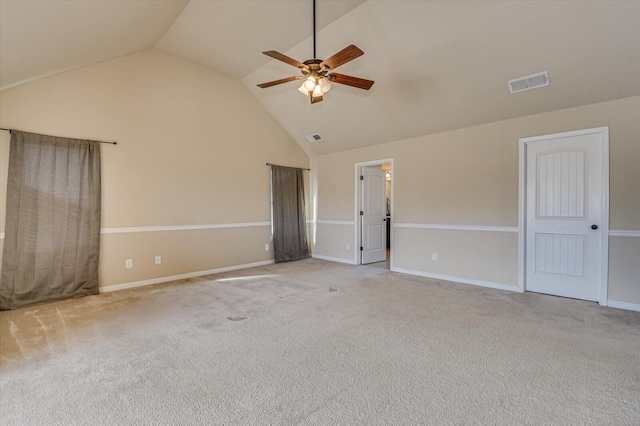 unfurnished room featuring ceiling fan, light carpet, and vaulted ceiling