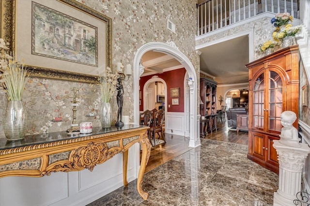 entrance foyer featuring ornamental molding