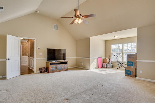 unfurnished living room featuring light colored carpet, high vaulted ceiling, and ceiling fan