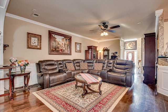 living room with dark wood-type flooring, ceiling fan, and ornamental molding