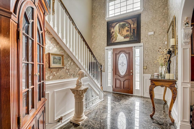 foyer with a towering ceiling