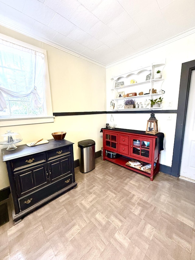 sitting room with ornamental molding